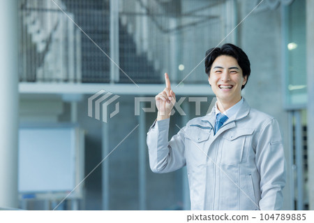 Man in work clothes Office building Man in work clothes Office building 104789885