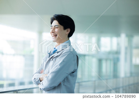 Man in work clothes Office building Man in work clothes Office building 104789890