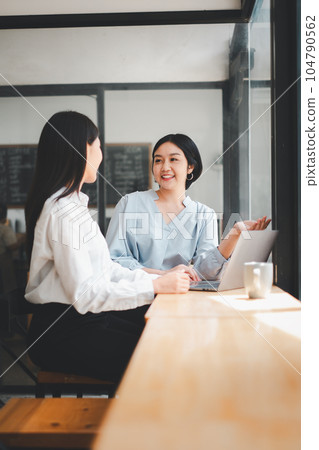 Smiling young business woman listening her partner on coworking space, Business concept. Smiling young business woman listening her partner on coworking space, Business concept. 104790562