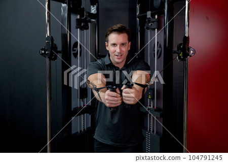 Young caucasian man workout with strength training and determination with fitness gym. Young caucasian man workout with strength training and determination with fitness gym. 104791245