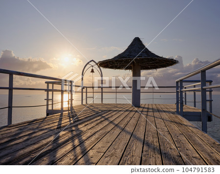 Sunset seen from the deck of the pier on the south island 104791583