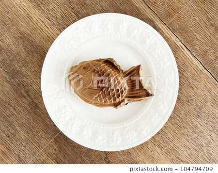 Taiyaki on a wooden table Taiyaki on a wooden table 104794709