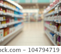 blurred supermarket with shelves 104794719