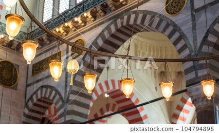 View of lamps inside the Suleymaniye mosque in Istanbul, Turkey. View of lamps inside the Suleymaniye mosque in Istanbul, Turkey. 104794898