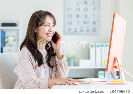 Young female engineer working in an office 104796670