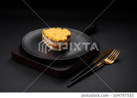 Delicious fresh mimosa salad with canned fish, egg, moinese, cheese, salt and spices 104797583