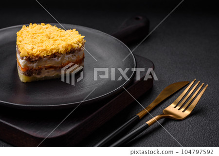 Delicious fresh mimosa salad with canned fish, egg, moinese, cheese, salt and spices Delicious fresh mimosa salad with canned fish, egg, moinese, cheese, salt and spices 104797592