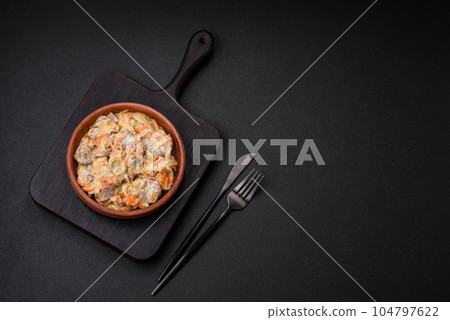 Delicious boiled beef or pork tongue sliced with carrots, onions, sour cream and spices 104797622