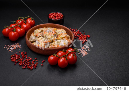 Delicious boiled beef or pork tongue sliced with carrots, onions, sour cream and spices 104797646