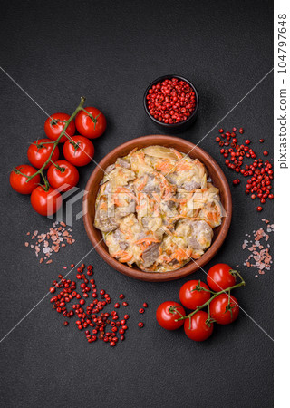 Delicious boiled beef or pork tongue sliced with carrots, onions, sour cream and spices 104797648