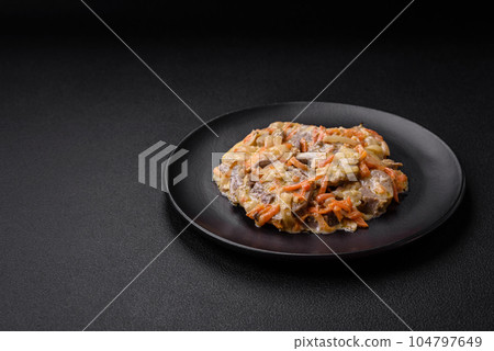 Delicious boiled beef or pork tongue sliced with carrots, onions, sour cream and spices Delicious boiled beef or pork tongue sliced with carrots, onions, sour cream and spices 104797649