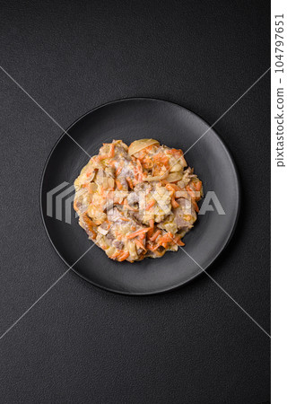 Delicious boiled beef or pork tongue sliced with carrots, onions, sour cream and spices Delicious boiled beef or pork tongue sliced with carrots, onions, sour cream and spices 104797651