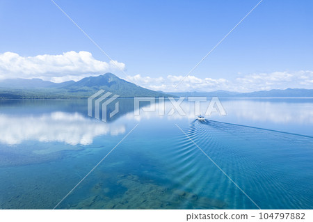 Aerial view of Lake Shikotsu in summer (sightseeing boat) Aerial view of Lake Shikotsu in summer (sightseeing boat) 104797882