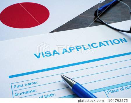 Empty visa application and flag of Japan. 104798275