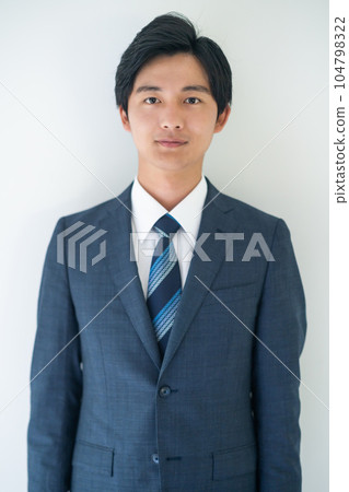 Young businessman looking at the camera Young businessman looking at the camera 104798322