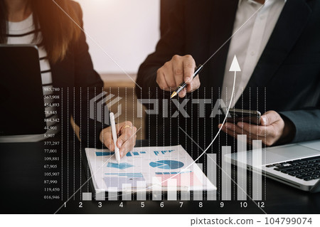 Business concept, Business man and business woman working and meeting with chart at office. 104799074