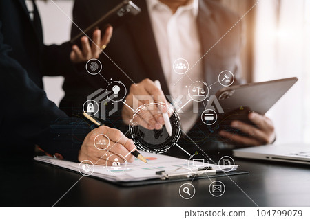 Copyright or patent concept, business team hand using laptop computer, tablet and smartphone with virtual screen copyright icon trademark, Creation ownership against piracy at office. 104799079