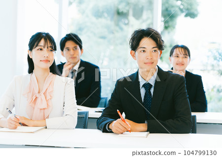 Working people taking seminars 104799130