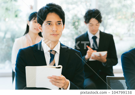 Working people taking seminars 104799138