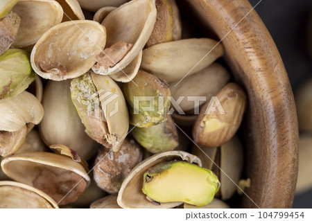 a large number of salty and crispy pistachios close-up a large number of salty and crispy pistachios close-up 104799454