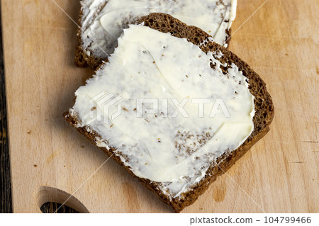 Black rye bread with butter Black rye bread with butter 104799466