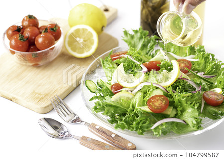 Colorful vegetable salad with delicious dressing (for healthy breakfast) white background Colorful vegetable salad with delicious dressing (for healthy breakfast) white background 104799587