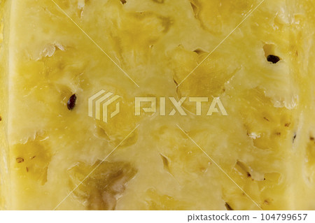 ripe pineapple of yellow-orange color cut into pieces ripe pineapple of yellow-orange color cut into pieces 104799657