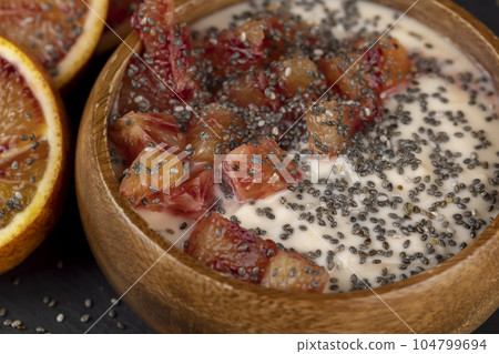 natural yogurt with the addition of pieces of ripe orange 104799694