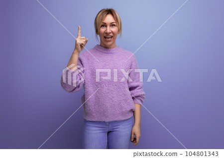 charming cute blondie woman in lavender sweater with brilliant idea on purple background with copy 104801343