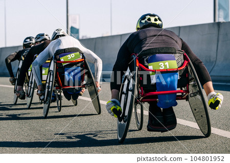 close-up group para athlete in wheelchair racing marathon race, sports summer games para athletics close-up group para athlete in wheelchair racing marathon race, sports summer games para athletics 104801952