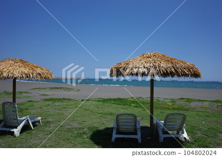 Cijin beach with white beach chairs in Kaohsiung, Taiwan 104802024