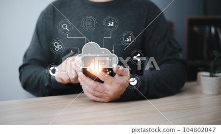 man holding cloud computing diagram show on hand. Data storage.Cloud technology.Secure backup and consistency Networking and internet service concept.Implementing storage technology in business man holding cloud computing diagram show on hand. Data storage.Cloud technology.Secure backup and consistency Networking and internet service concept.Implementing storage technology in business 104802047