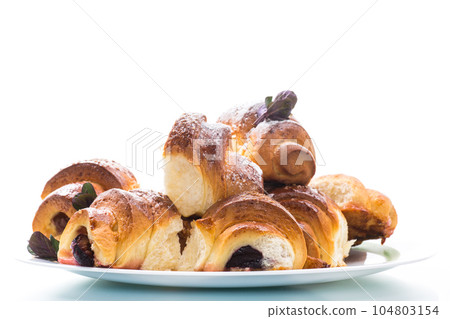 baked sweet homemade buns with plum inside 104803154