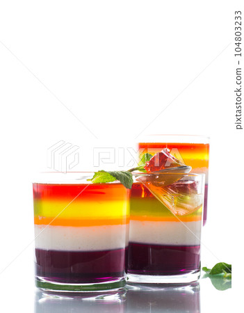 lot of colored sweet fruit jelly in a glass lot of colored sweet fruit jelly in a glass 104803233