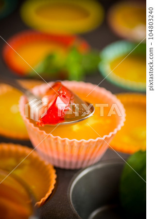 lot of colored sweet fruit jelly in a glass 104803240