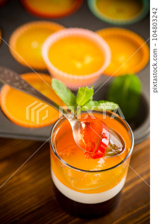 lot of colored sweet fruit jelly in a glass lot of colored sweet fruit jelly in a glass 104803242
