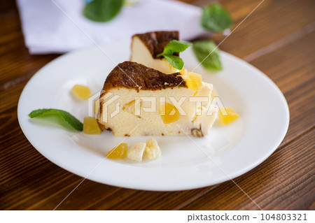 sweet baked cottage cheese casserole with nuts and candied fruits sweet baked cottage cheese casserole with nuts and candied fruits 104803321