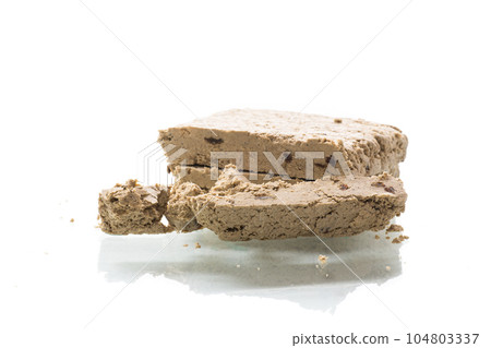 piece of sweet halva on white background 104803337
