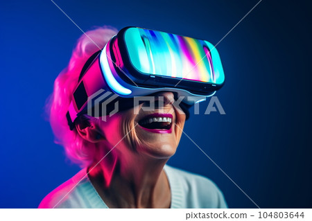 Senior woman having fun with virtual reality glasses. Old people using new headset goggles trends technology Senior woman having fun with virtual reality glasses. Old people using new headset goggles trends technology 104803644