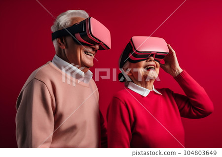 Senior mature couple having fun with virtual reality glasses. Old people using new headset goggles trends technology Senior mature couple having fun with virtual reality glasses. Old people using new headset goggles trends technology 104803649