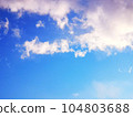 Blue sky with sun and clouds 104803688