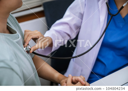 Doctor healthcare. Professional medical doctor in white uniform gown coat interview consulting patient reassuring his male patient helping hand 104804234