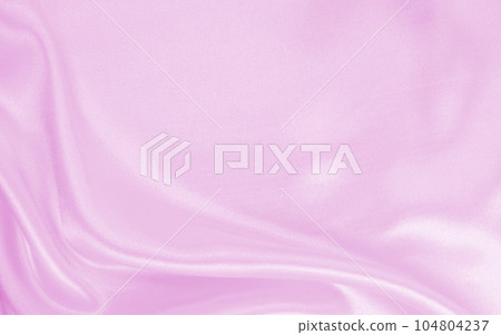 Smooth elegant pink silk or satin texture as wedding background. Luxurious background design Smooth elegant pink silk or satin texture as wedding background. Luxurious background design 104804237