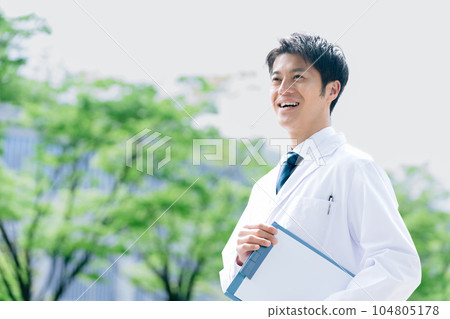 Outdoor portrait of a male doctor 104805178