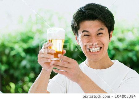 Male drinking beer Male drinking beer 104805384