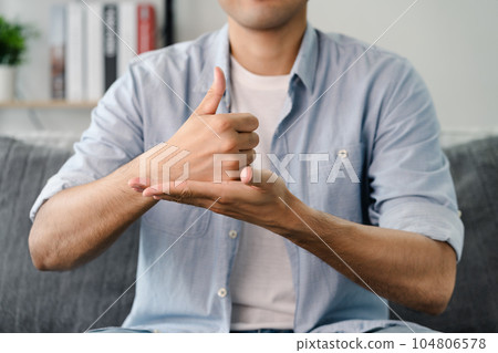 Happy young deaf man using sign Language to communicate with other people.. Happy young deaf man using sign Language to communicate with other people.. 104806578