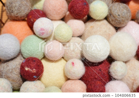 A lot of balls made from wool felt A lot of balls made from wool felt 104806635