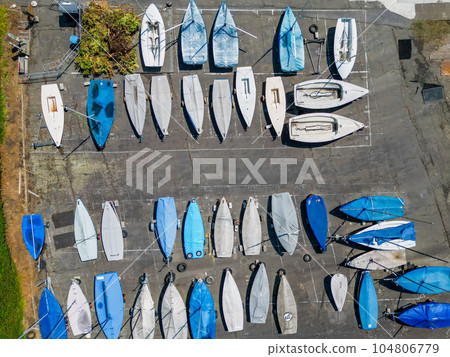 Aerial view of the sailing club. Aerial top-down view of docked sailboats in marine bay. Top down 104806779