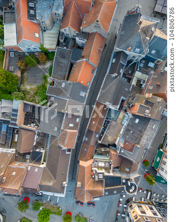 Aerial top view of residential area houses roofs and streets from above, old town background 104806786