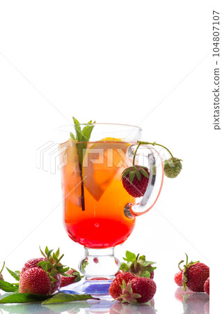 refreshing cool strawberry lemonade with lemon, ice and mint in a glass refreshing cool strawberry lemonade with lemon, ice and mint in a glass 104807107